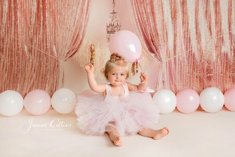 girls first birthday pink photoshoot with balloons
