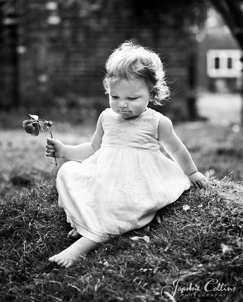 Onlocation Photographer Hollingbourne little girl with a flower in her hand