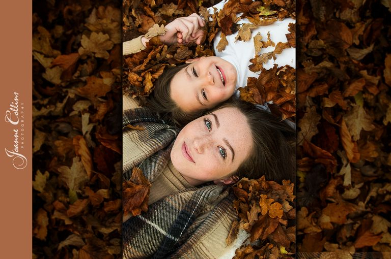 Family Onlocation Photographer Mote Park with Siblings laying amongst the autumn leaves