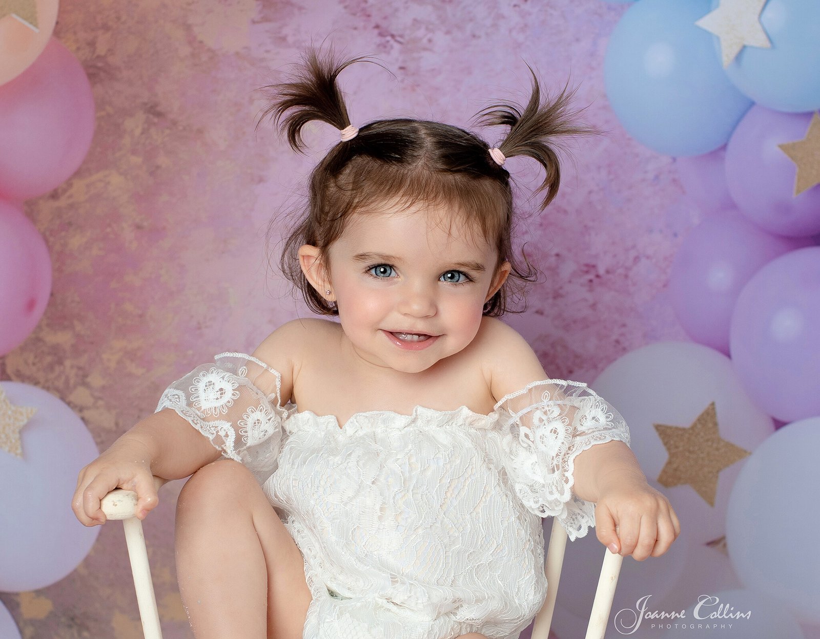 cake smash photographer sittingbourne kent baby girls first birthday session in bunches
